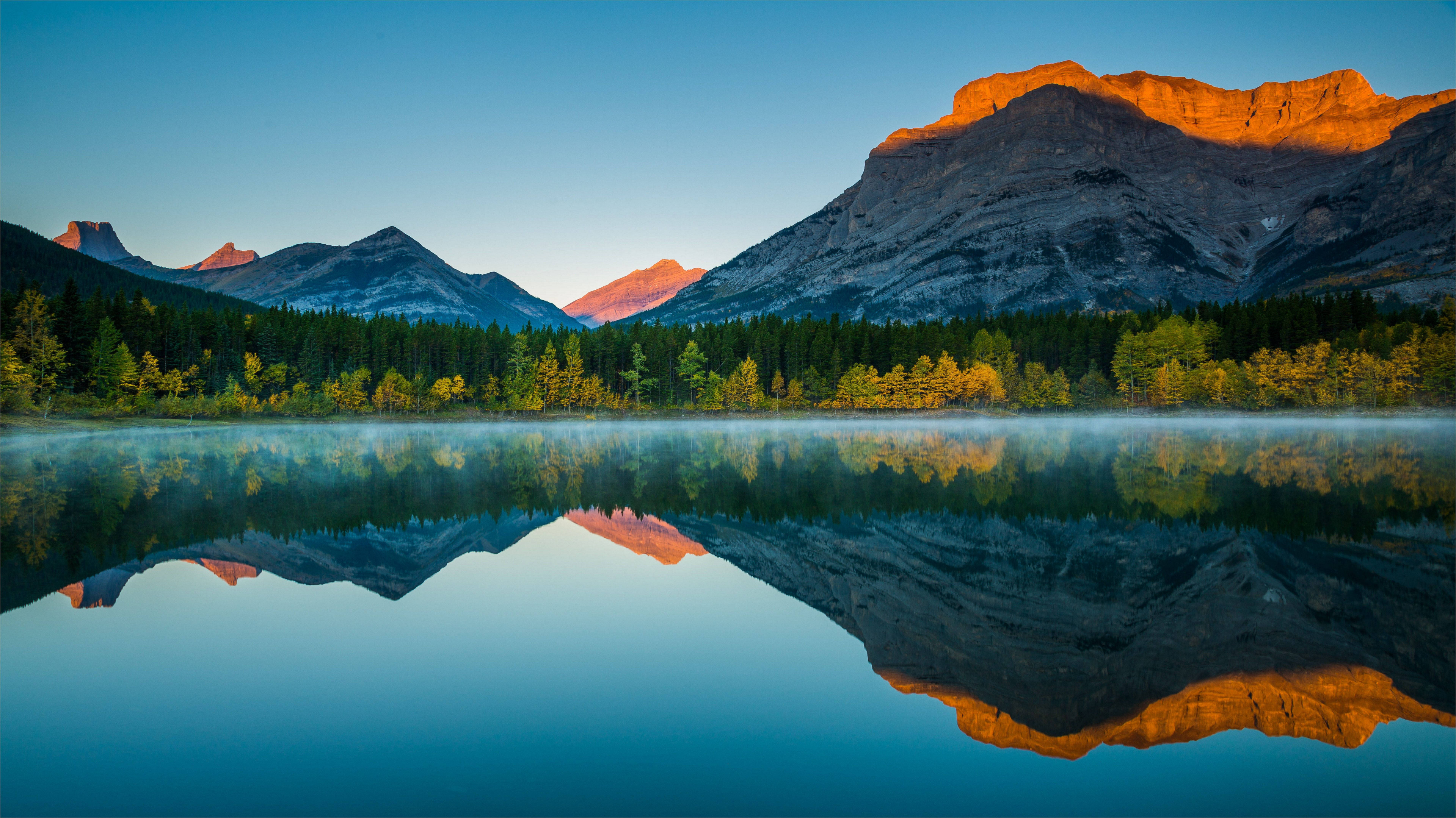 Mountain lake reflection at sunrise